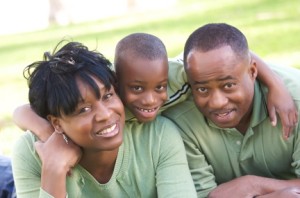 Man, Woman and Child having fun in the park.