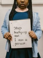 AAt_8_y_o_black_girl_with_anti_bullying_sign