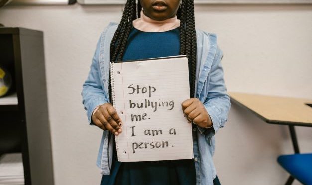 AAt_8_y_o_black_girl_with_anti_bullying_sign